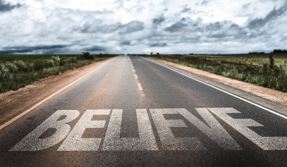 Believe written on rural road