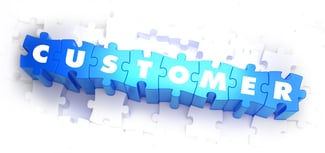 Customer - Word on Blue Puzzles on White Background. 3D Render.