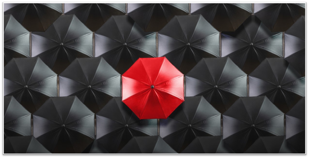 Differentiation Red Umbrella in Black Umbrellas